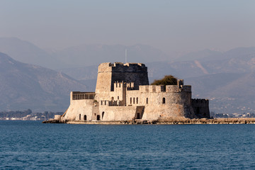 Fototapeta na wymiar Sea, stone, Venetian fortress in the city Nafplio (Greece, Peloponnese)