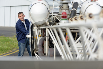 man near an helicopter