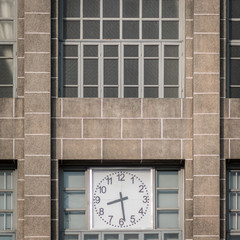 old clock on brick wall