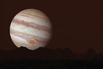 Jupiter silhouette mountain on cloud and night sky