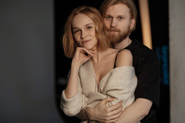 Portrait of couple, close to each other, hugging