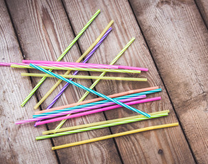 Plastic straws on wooden background plastic free concept