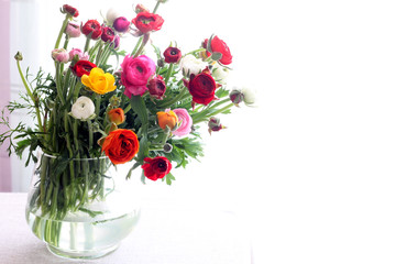 Bouquet of flowers in vase isolated on white