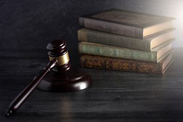 Judges Gavel on a Desk with Books in the Background