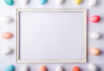 Eggs flat lay on a white background. Easter and spring composition. Copy space.