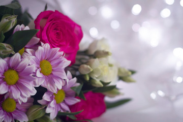 Floral festive background template. A bouquet of flowers on a light background bokeh.