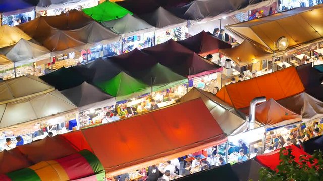 Colorful food stalls at "Ta lad Rod Fai" Train outdoor Night Market Ratchada in Bangkok, Thailand. Bangkok is the capital and most populous city of Thailand.BANGKOK THAILAND