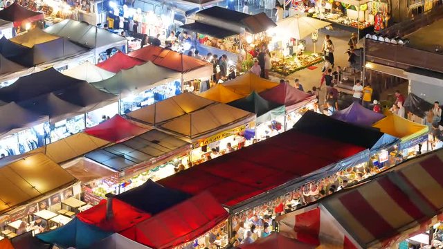 Colorful food stalls at "Ta lad Rod Fai" Train outdoor Night Market Ratchada in Bangkok, Thailand. Bangkok is the capital and most populous city of Thailand.BANGKOK THAILAND