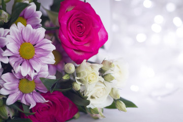 Floral festive background template. A bouquet of flowers on a light background bokeh.