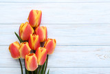 Bouquet of tulips on wooden table