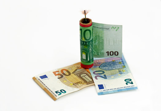 euro banknote, money around a firecracker with a burning wick, concept waste of money at silvester