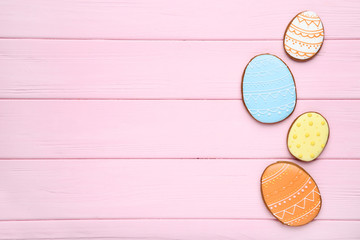 Easter gingerbread cookies on pink wooden table