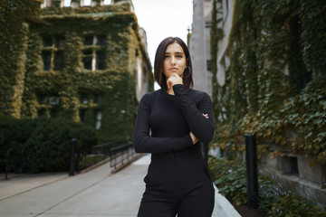 brunette girl walking through the park in Chicago during fall