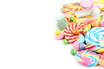 Sweet candies and lollipops on white background