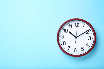 Round clock on blue background