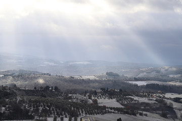 The Chianti landscape in the Tuscan hills after a winter snowfall, Italy