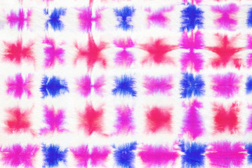 colorful tie dye pattern hand dyed on cotton fabric abstract background.