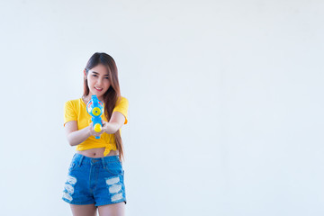Asian sexy woman with water in hand on white background,Festival songkran day at thailand,The best of festival of thai,Land of  smile