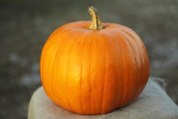 orange melon on a small wooden table