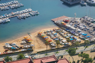 Small beach near to nautical marina, boats and water