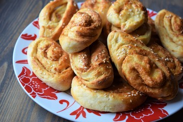 Fresh salt cake with cheese and garlic on a wooden table