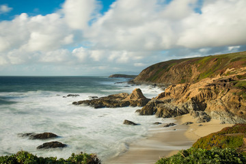 Long exposure of waves crashing along the California coast along Highway 1