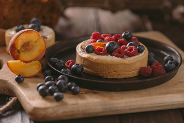Small red and blue fruit on the cake pie cookie