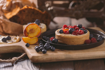 Small red and blue fruit on the cake pie cookie