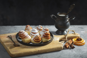 cinnamon rolls sinabon made at home, lying on a grey table. Homemade cakes
