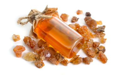 Myrrh essential oil. Isolated on white background.