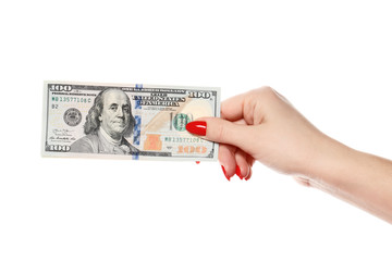 Perfect women hand hold one hundred dollars isolated on white background. Perfect red manicure.