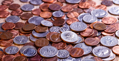 Pile of Golden coin, silver coin, copper coin, quarters, nickels, dimes, pennies, fifty cent piece and dollar coins. Various USA coins, American coins for business, money, financial coins and economy