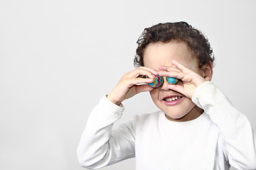 little boy with sweet chocolate Easter eggs