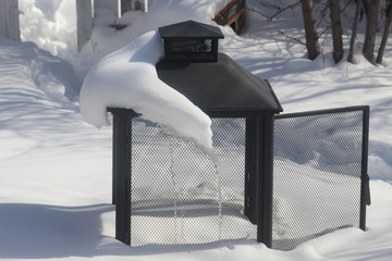 Winter snow covered fire pit