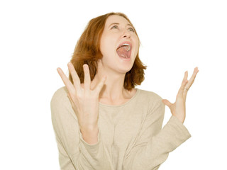 A very angry  young woman is clenching her fingers in rage. Isol
