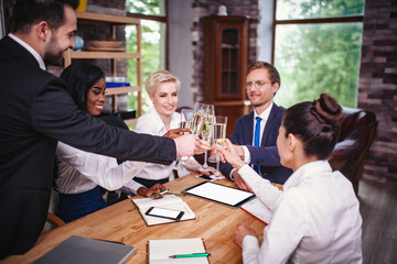 Corporate business team meeting in a modern open plan office