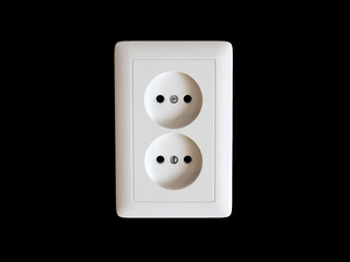 White double electrical outlet on wooden black background