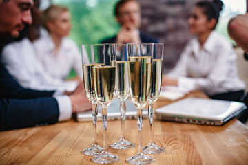 Business colleagues celebrate the successful project