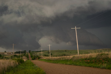 Storm clouds over the road in the countryside of northwestern Oklahoma. Incoming Rear Flank...