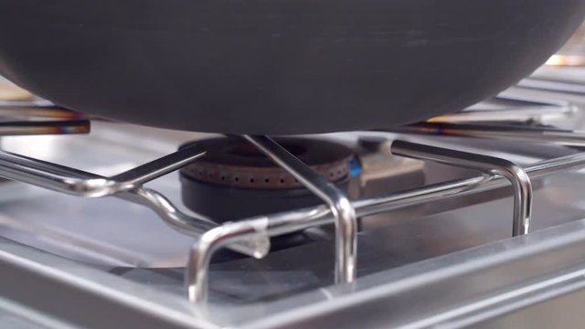 Chaf opens gas - stove on the machine in cooking training seminar event.