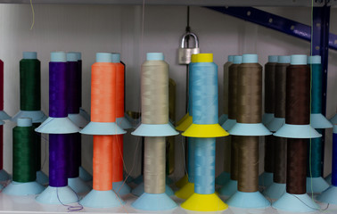 Shelf with multi-colored skeins of thread