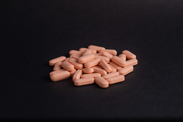 pills in black background