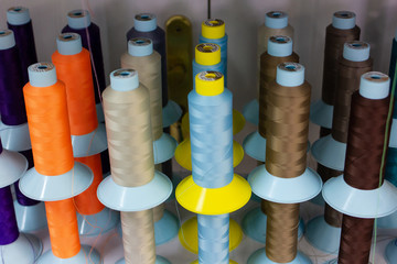 Shelf with multi-colored skeins of thread
