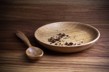 Fasting, Lent. Plate with spoon and crumb on wooden background