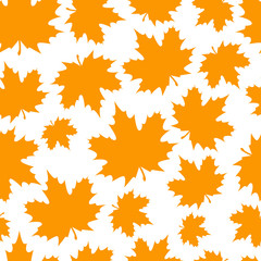 Abstract background from a variety of bright maple leaves on a white background. Seamless pattern.