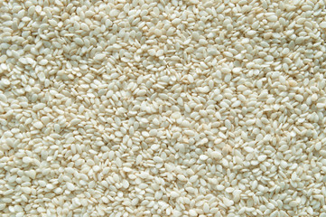 White sesame seeds for cooking top view, background.