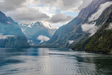 Morning passage through the iconic Milford Sound in Fiordland National Park, South Island, New Zealand