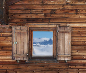 Wooden wall with window of hotel in mountains