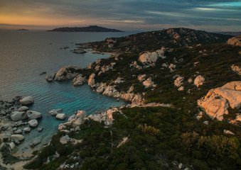 Scenic Sardinia island landscape. Italy sea ​​coast with azure clear water. Nature background. Aerial image with warm evening light.