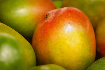 Group of fresh mangoes at fruit market